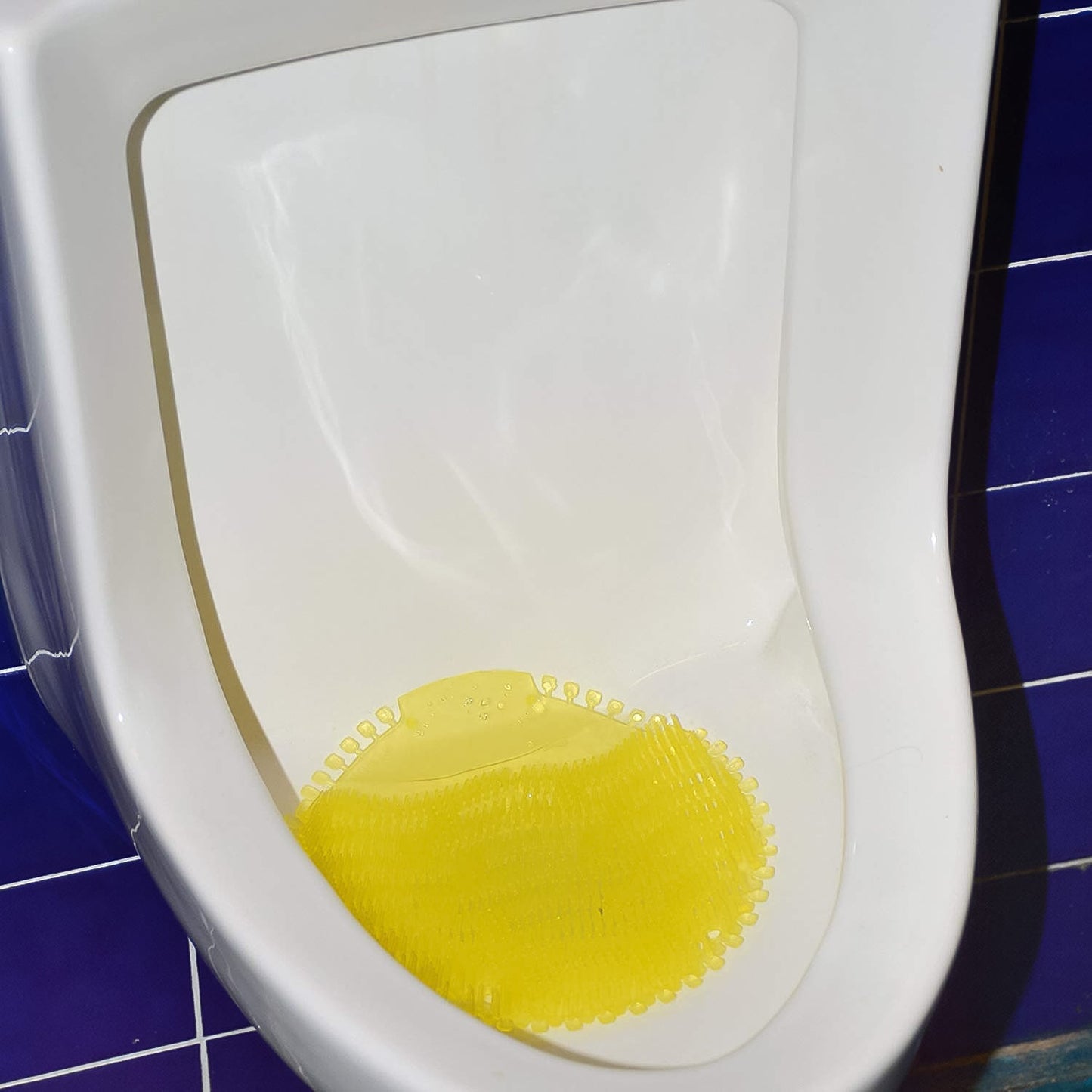 Urinal screen deodorizer mat designed to prevent splashes and control odors in menâs washrooms