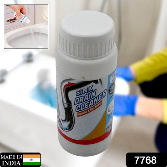 Clog remover powder being poured into a kitchen sink drain for effective cleaning.