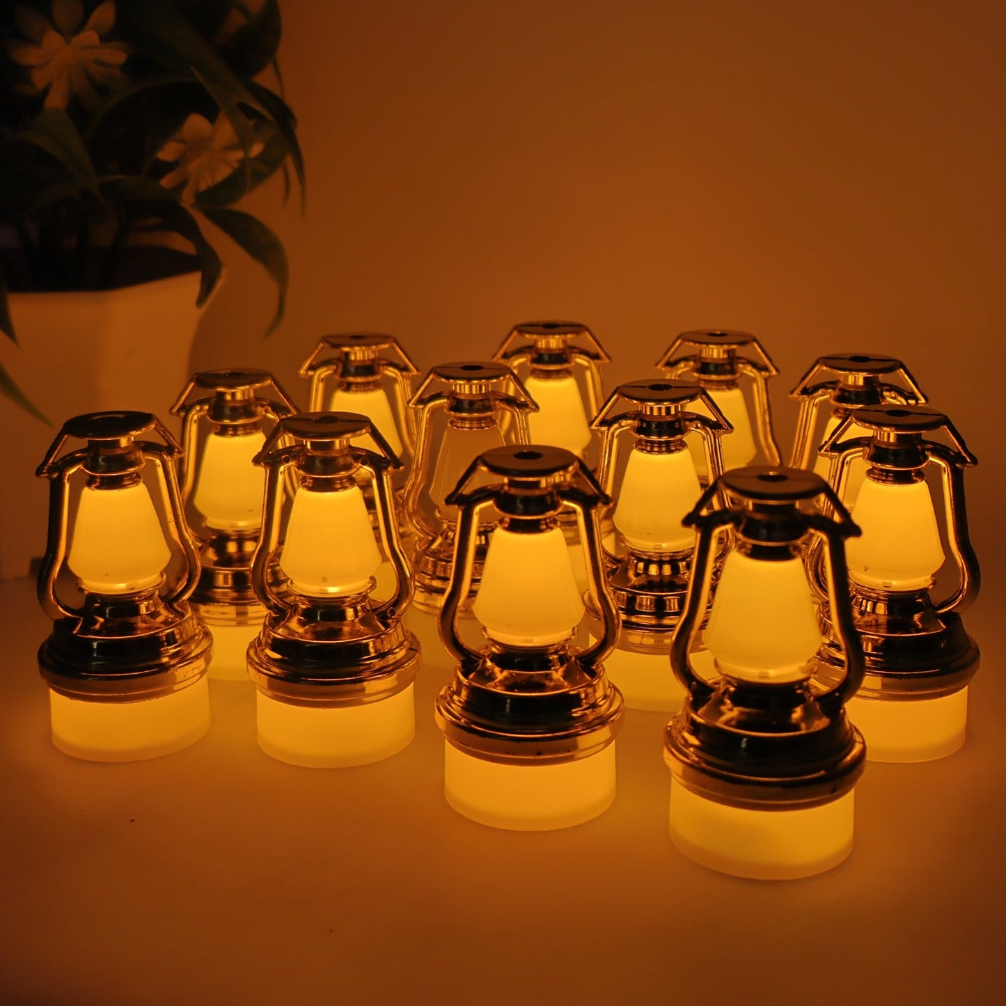 Set of 12 vintage lantern flameless LED candles emitting warm yellow light