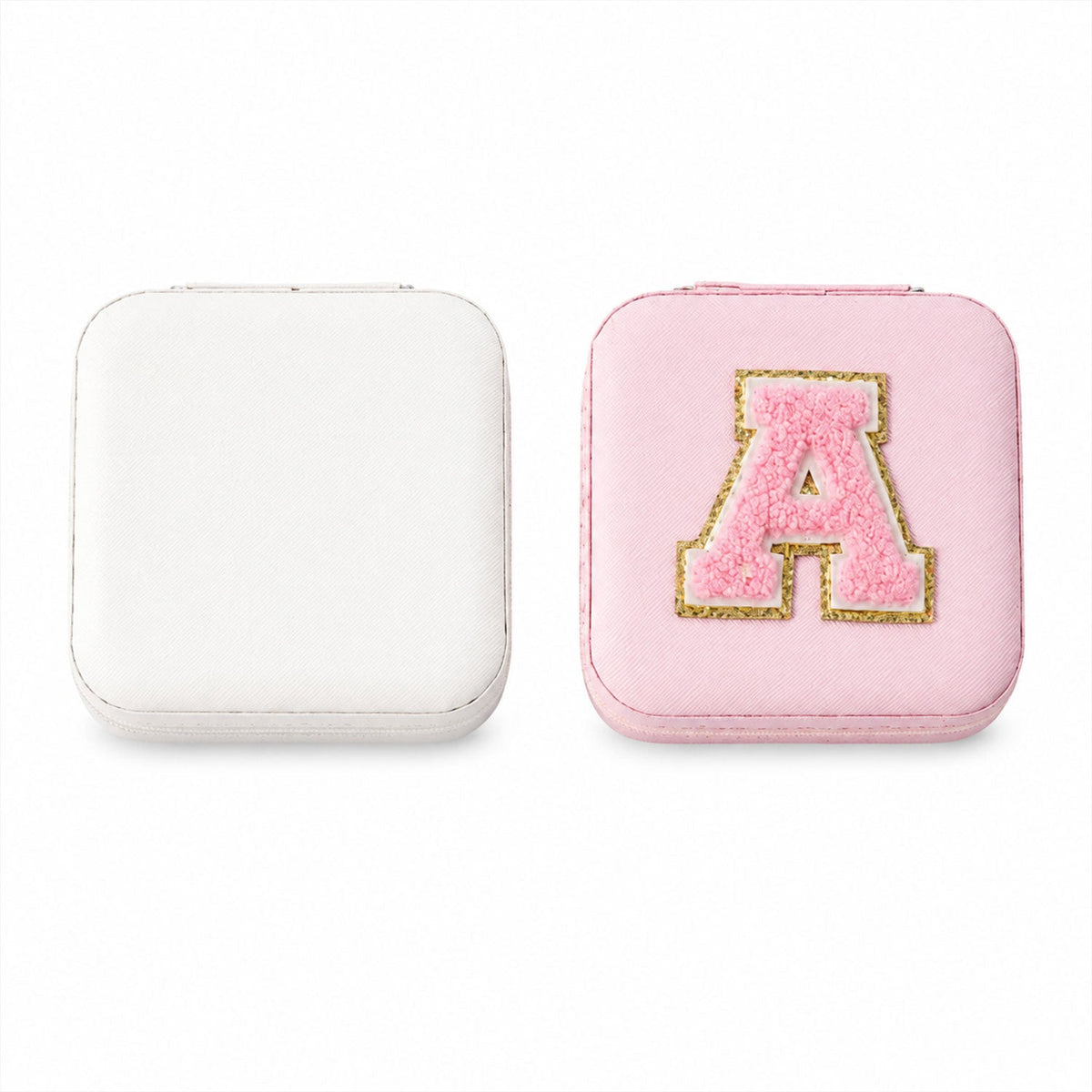 The LilyGleam travel jewellery box placed next to travel essentials like a passport and sunglasses.